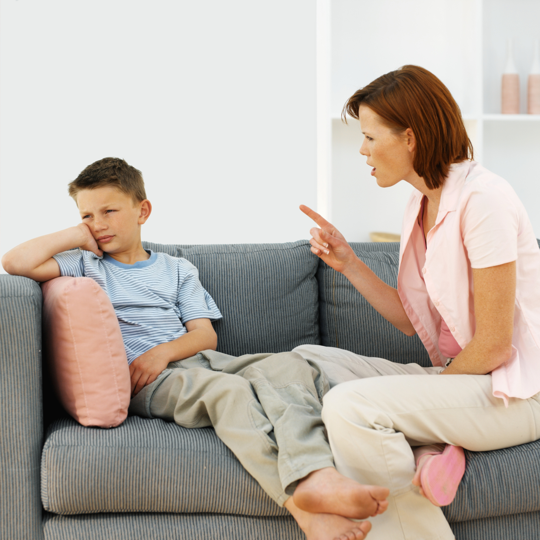 Mother giving out to her son